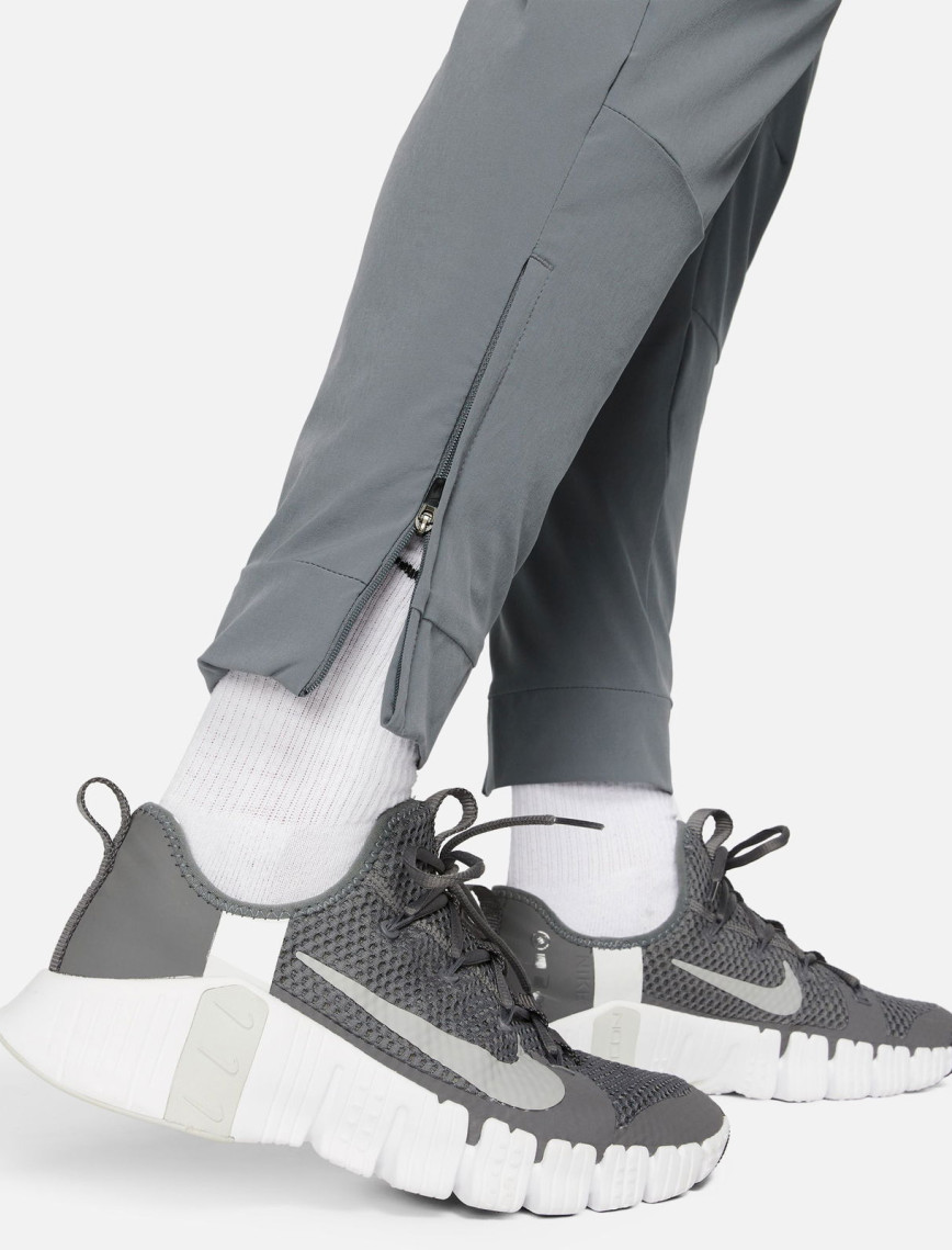 Nike Dri-FIT Unlimited Erkek Gri Eşofman Altı Nike Dri-FIT Unlimited Erkek Gri Eşofman Altı