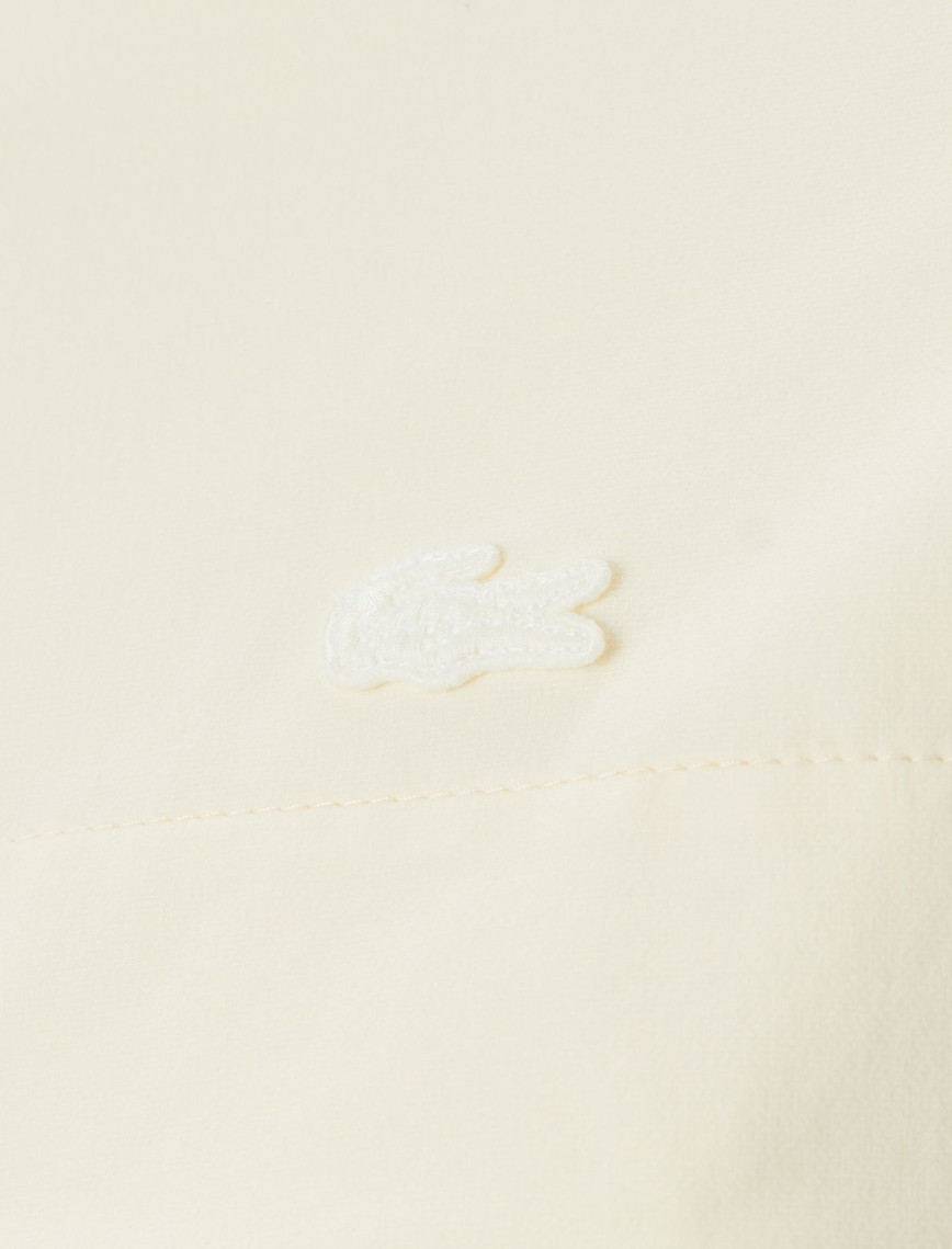 Lacoste Kadın Kapüşonlu Baskılı Beyaz Mont Lacoste Kadın Kapüşonlu Baskılı Beyaz Mont