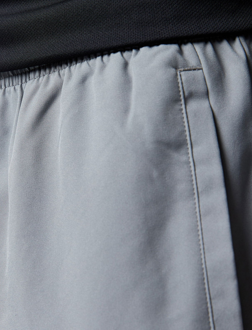 Nike Dri-Fit Challenger Woven Erkek Gri Eşofman Altı Nike Dri-Fit Challenger Woven Erkek Gri Eşofman Altı