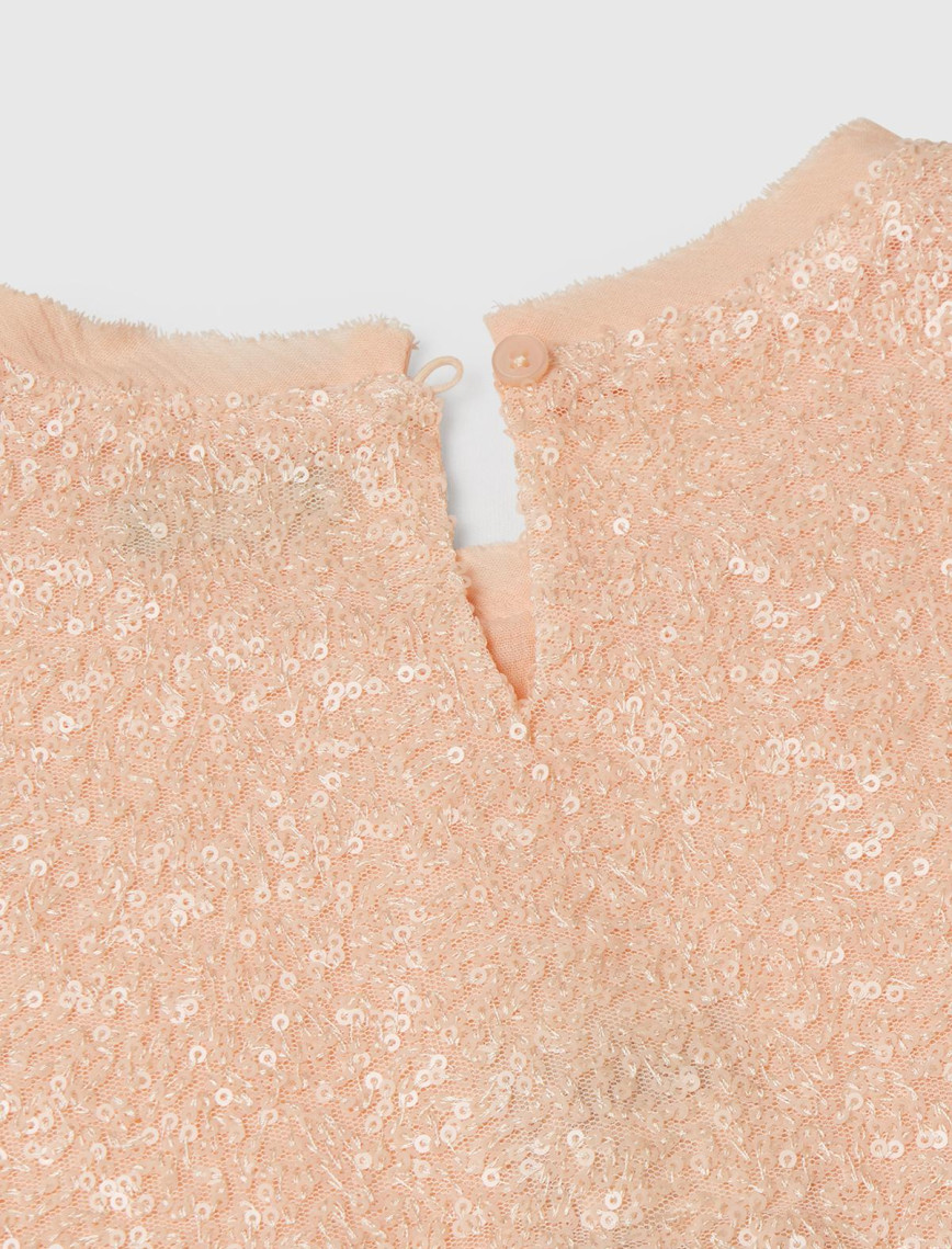 Kız Çocuk Yavruağzı Payetli Tül Astarlı Arkası Tek Düğmeli Kısa Kollu Bluz Kız Çocuk Yavruağzı Payetli Tül Astarlı Arkası Tek Düğmeli Kısa Kollu Bluz