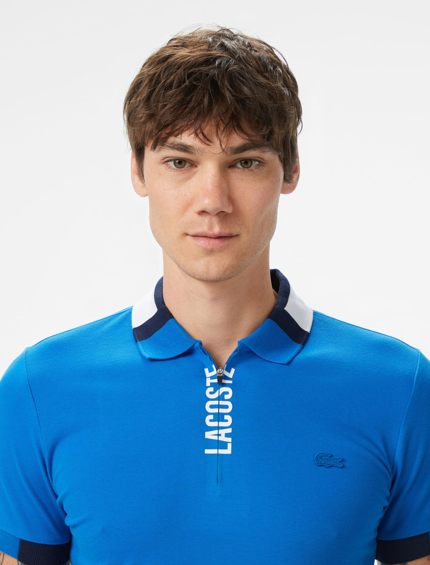Lacoste Erkek Regular Fit Yarım Fermuarlı Baskılı Mavi Polo Lacoste Erkek Regular Fit Yarım Fermuarlı Baskılı Mavi Polo